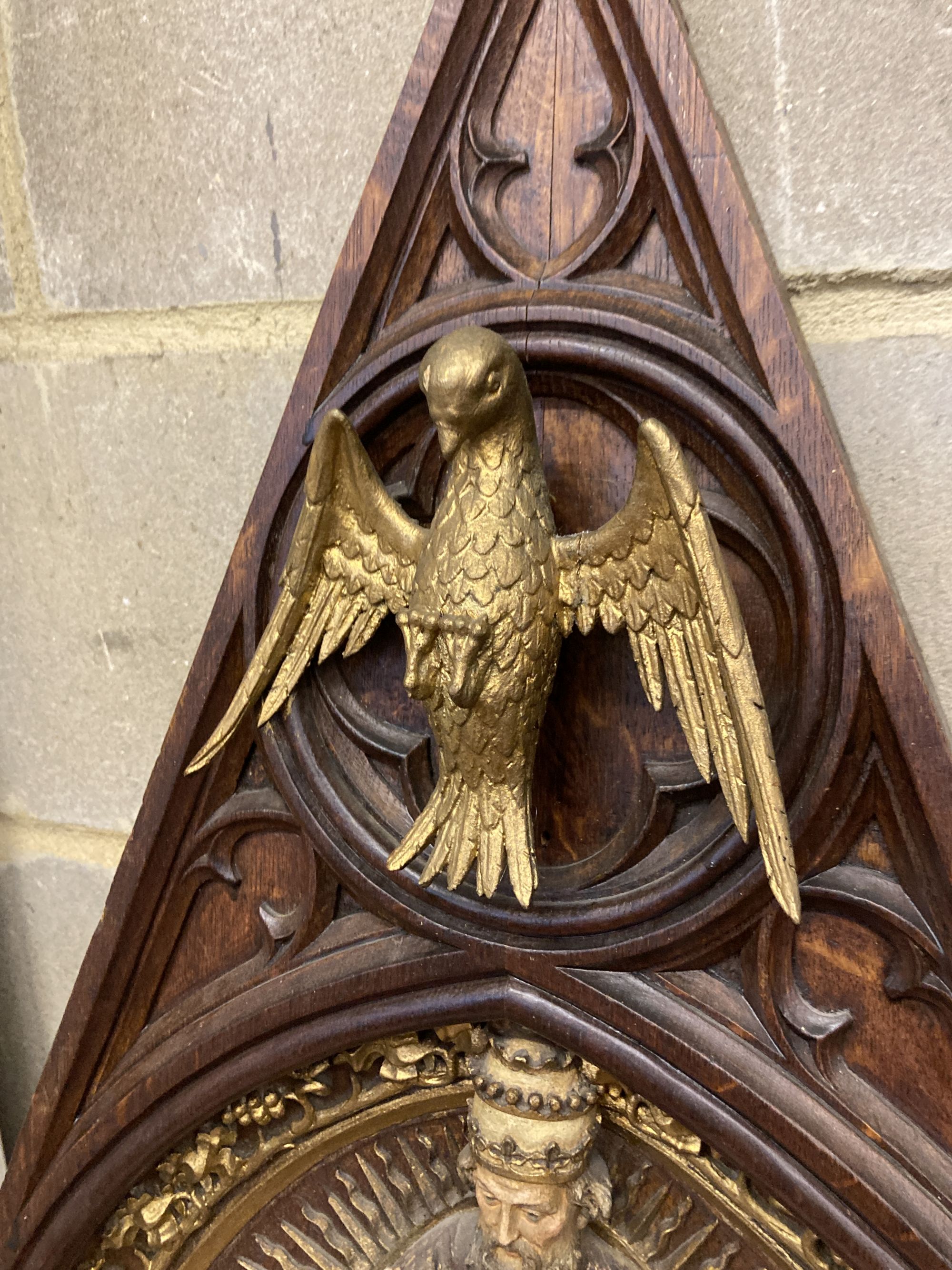 A Gothic oak ecclesiastical wall plaque, width 46cm, height 67cm